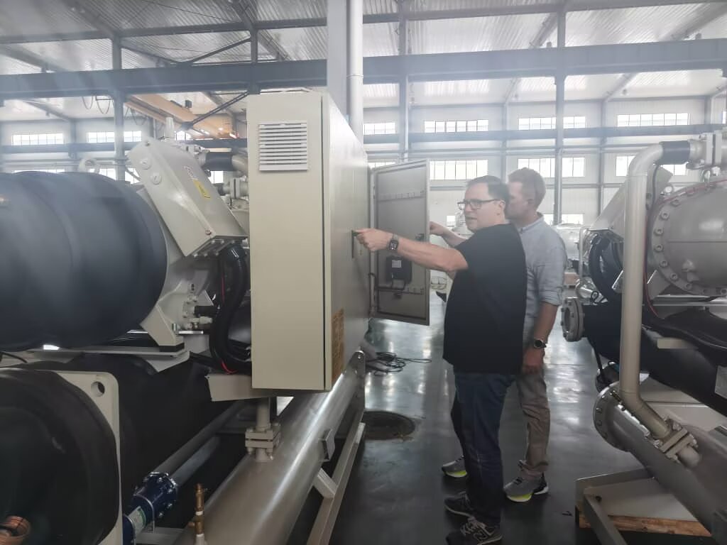 GESON engineers commissioning an industrial water chiller in the factory